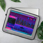 Load image into Gallery viewer, Open sleeve with a laptop peeking out, staged with some totally-not-plastic leaves around it.
