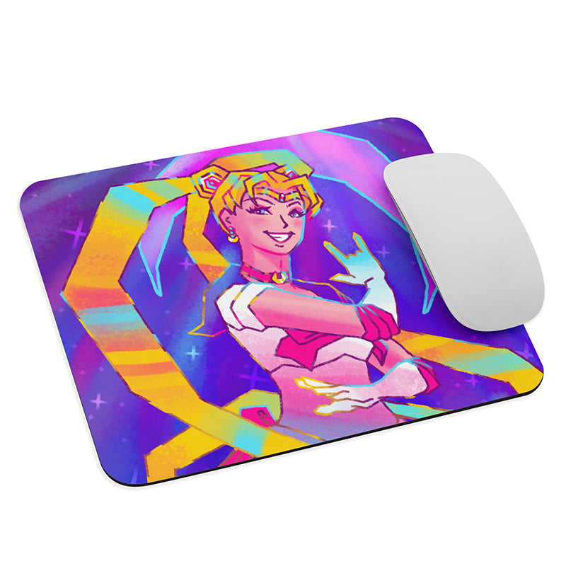 Mouse pad featuring a girl in a sailor outfit striking a pose with golden hair spiraling around her. stars fill the background and a large crescent moon hangs behind her. 