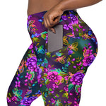 Load image into Gallery viewer, Closeup of the legging&#39;s side pocket, the model is pulling a phone out. There is plenty of room in the pocket for the phone to fit comfortably.
