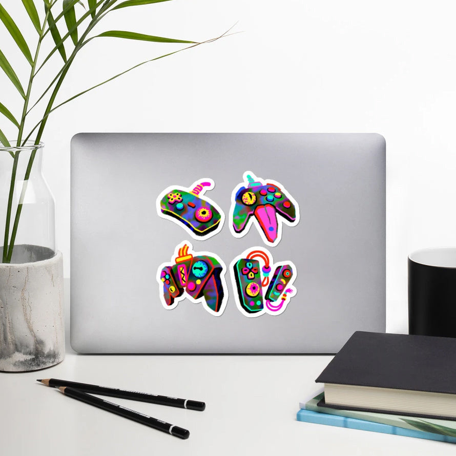 "Mitosis" stickers on a laptop.